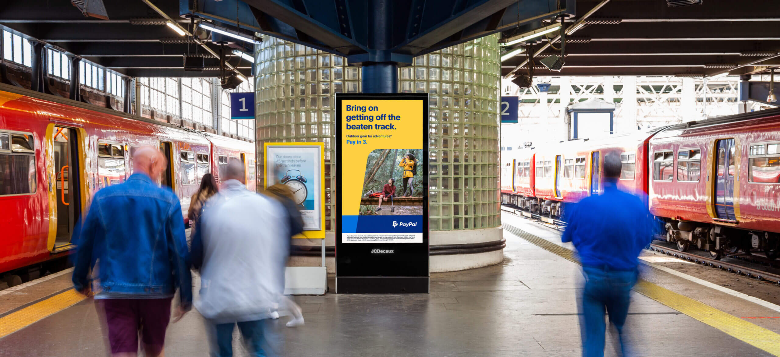 PayPal's pay in 3 campaign on a station platform.